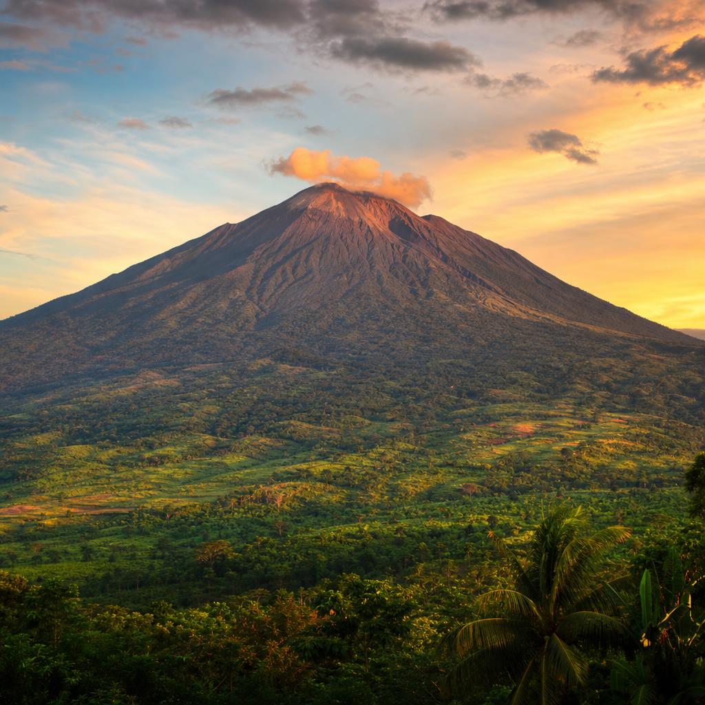 Mount Cameroon dominates the horizon during a serene sunset in this African nation.